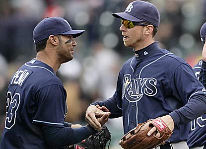 Carlos Pena and Ben Zobrist soak in the improbable win that comes against Justin Verlander, who is stellar for the most part. (AP)