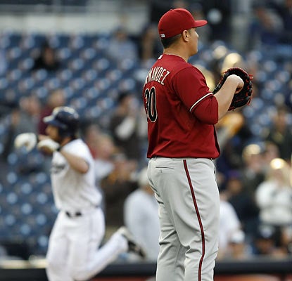 Chris Denorfia hits a two-run blast off David Hernandez in the eighth to give the Padres a lead they would not relinquish. (AP)