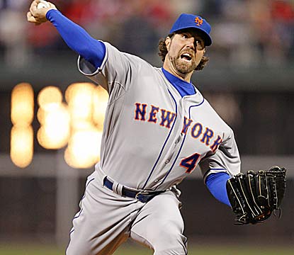 Despite nine hits, R.A. Dickey allows just one run while striking out seven against the defending NL East champs. (Getty Images)