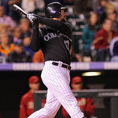 Todd Helton drives in three runs, including the go-ahead RBI in the eighth, to lead the Rockies past the Diamondbacks.  (Getty Images)