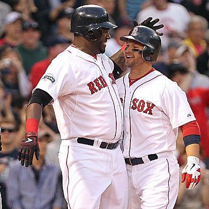 David Ortiz (left) collects four of the Red Sox's 15 hits, including his first home run of the season.  (Getty Images)
