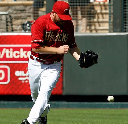 The Diamondbacks' Jason Kubel is unable to catch Neil Walker's bloop, which gives the Pirates the winning run.  (AP)