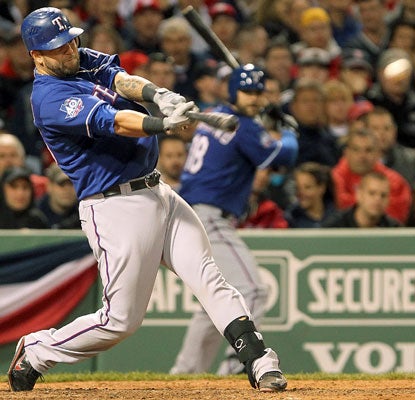 Mike Napoli continues to pound the Red Sox with a two-run homer and four RBI in the Rangers' sixth straight win.  (Getty Images)