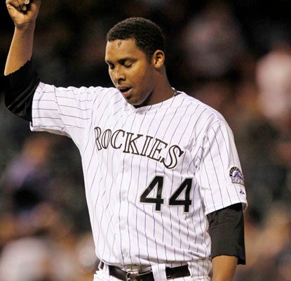 Juan Nicasio tips his cap to the home fans after 6 1/3 innings in his first win since getting hit by a line drive last season.  (AP)