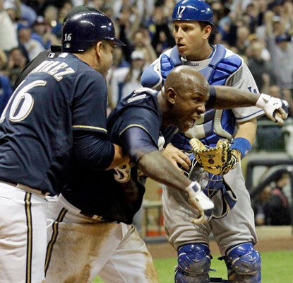 Nyjer Morgan is called safe at home plate, sending the Brewers home happy with a win over the Dodgers.  (AP)