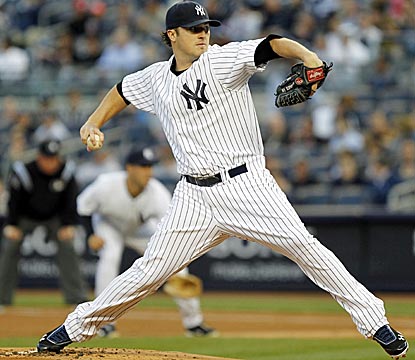 After giving up four first-inning runs, Phil Hughes puts up four straight zeroes to keep the Yanks in the game.  (US Presswire)