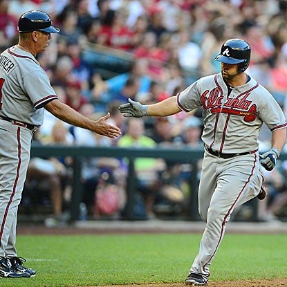 Dan Uggla's home run breaks a 2-all tie to lift the Braves over the Diamondbacks, their 10th win in 11 games. (US Presswire)