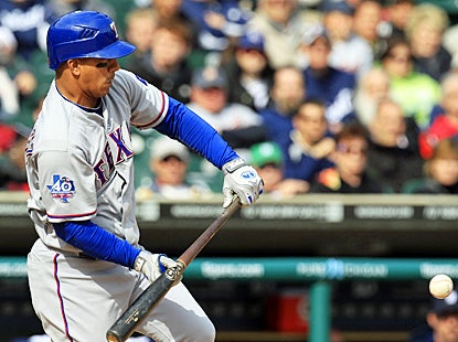 Alberto Gonzalez connects on a squeeze bunt that turns into a RBI single in the 11th inning. (AP)