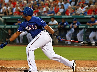 The Rangers' Adrian Beltre follows through on a RBI single in the third inning against the Yankees. (Getty Images)