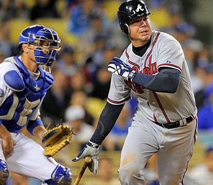 Chipper Jones follows through on his ninth-inning single that drives in the go-ahead run against the Dodgers. (AP)