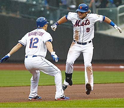 Kirk Nieuwenhuis drives in the winning run for the Mets, who walk four times against Marlins All-Star closer Heath Bell. (US Presswire)