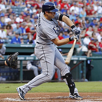 Evan Longoria homers to key a four-run first inning that leads the Rays past the Rangers.  (US Presswire)
