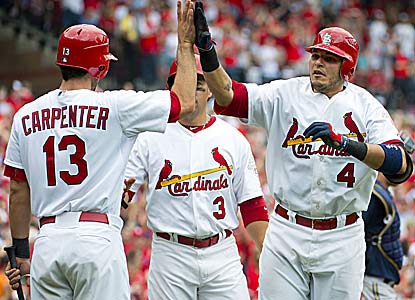 Yadier Molina gets praise after tying his career high with a 4-for-4 outing, which includes a two-run tiebreaking homer.  (US Presswire)