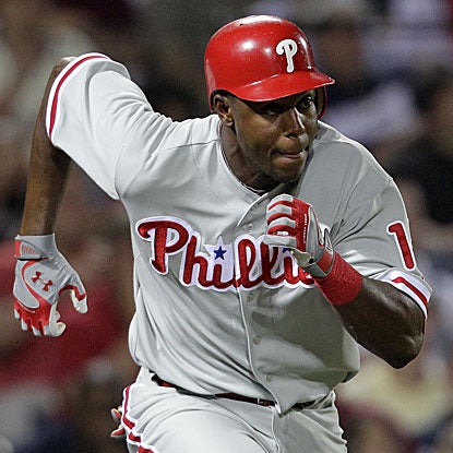 John Mayberry Jr. doubles and scores the go-ahead run in the eighth inning  to help the Phillies get past the Braves.  (AP)