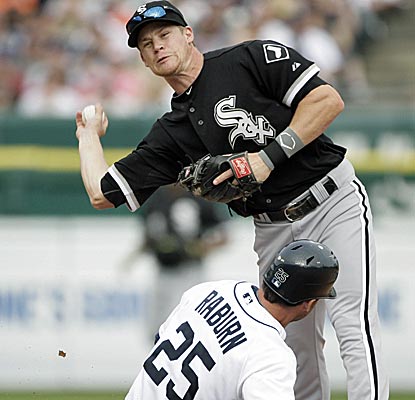 Gordan Beckham is unable to complete the double play as Detroit's Austin Jackson bears down.  (AP)