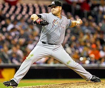 Mark Buehrle confuses the Padres for much of the night, allowing just five hits en route to a complete-game victory. (AP)