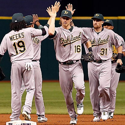 Jonny Gomes' (No. 31) 12-inning HR proves to be the winning run for the A's, ending the Ray's six-game winning streak.  (Getty Images)