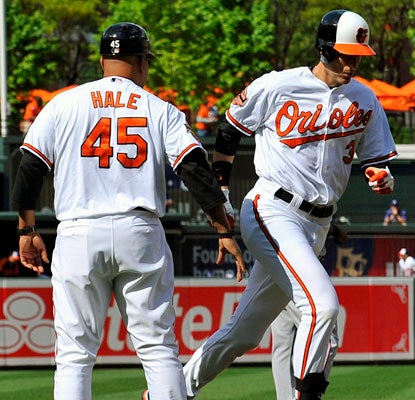 Ryan Flaherty and the Orioles become the first AL team to start a game with three straight home runs.  (US Presswire)