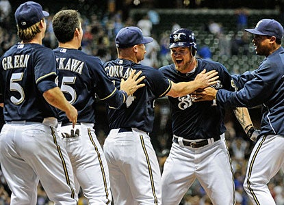 Teammates cheer Corey Hart (1) after his RBI single that gives Milwaukee the win over the Cubs. (US Presswire)