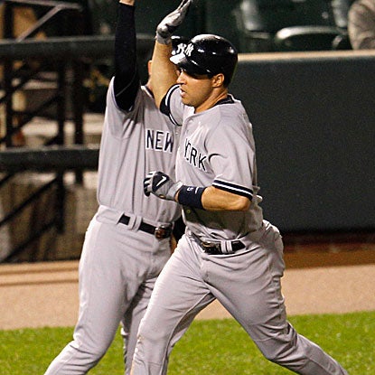 A struggling Mark Teixeira comes through with a two-run home run to break a seventh-inning tie for the Yankees.  (Getty Images)