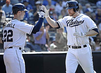 Chase Headley homers, doubles and drives in three as the last-place Padres get a rare win vs. the No. 1 team in the NL West. (Getty Images)