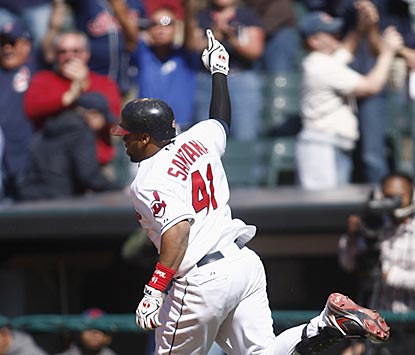 Carlos Santana celebrates after drilling a fastball past a drawn-in infield for the winning hit.  (Getty Images)