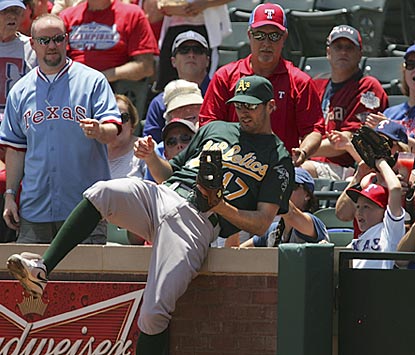 Oakland first baseman Adam Rosales, just called up from the minors, not only makes this catch but gets on base four times. (Getty Images)
