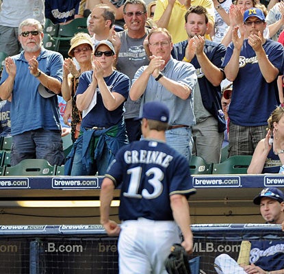 Brewers fans applaud Zack Greinke, who exits in the seventh and on his way to improve to 14-0 at Miller Park. (US Presswire)