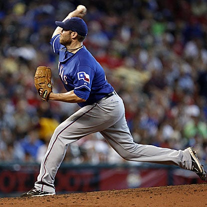 Colby Lewis allows one run in eight innings and collects two RBI as he earns the win for the Rangers.  (US Presswire)