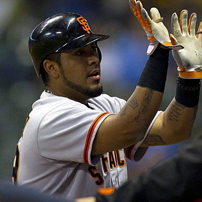Hector Sanchez's lead-off homer in the top of the 14th inning snaps a 3-all tie in the Giants' win against the Brewers.  (US Presswire)
