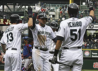 Alex Liddi (center) hits the first major-league grand slam by an Italian-born player since 1958 (Reno Bertoia).  (Getty Images)