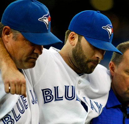 Brandon Morrow suffers a bruised right shin and is helped off the field in the seventh inning.  (US Presswire)