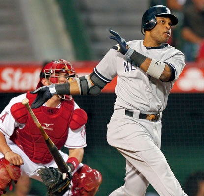 Robinson Cano hits a two-run shot to help the Yankees avoid a sweep to the Angels.  (AP)