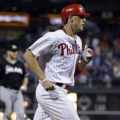 Hunter Pence goes 3 for 4 with a two-run home run as the Phillies hold on to defeat the Marlins.  (AP)