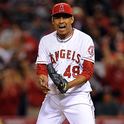 The Angels closer Ernesto Friere strikes out the Rangers' Josh Hamilton in the ninth inning to earn the save.  (US Presswire)
