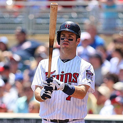 Joe Mauer returns to the Twins' lineup after a four-game absence and collects three hits and two RBI.  (Getty Images)