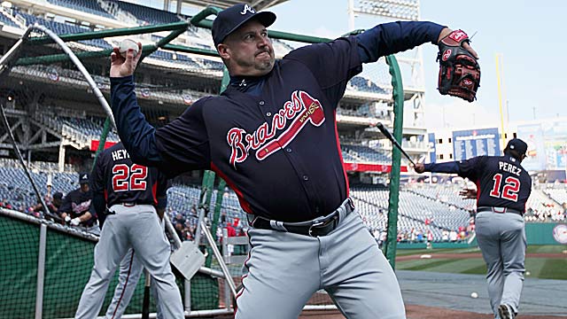 Fredi Gonzalez and the Braves know one hitting coach can't monitor 13 guys at the same time. (Getty Images)