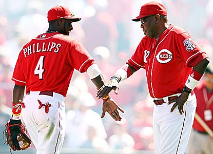 Brandon Phillips, getting praise from Dusty Baker, homers and drives in four a day after taking a Derek Lowe pitch on his arm. (Getty Images)