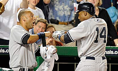 Derek Jeter and Curtis Granderson do most of the damage in the matchup of first-place teams, combining for four RBI. (Getty Images)