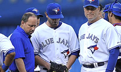 Drew Hutchison exits in the first inning with a sore elbow, but five Toronto relievers combine on a five-hitter vs. Phillies. (Getty Images)