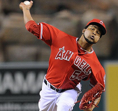 Ervin Santana retires the first 20 batters and has a perfect game broken by a Justin Upton single in the seventh. (US Presswire)