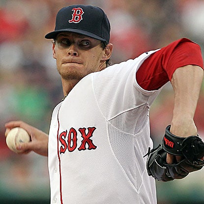 The Red Sox's Clay Buchholz allows five runs in six innings but hangs on to win his fourth straight. (Getty Images)