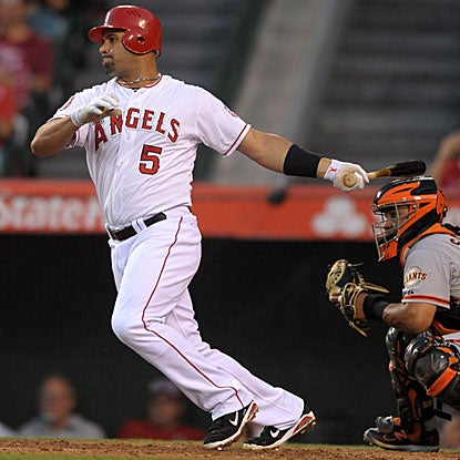 Albert Pujols connects for a three-run HR in the first inning and drives in four runs overall in the Angels' victory.  (Getty Images)
