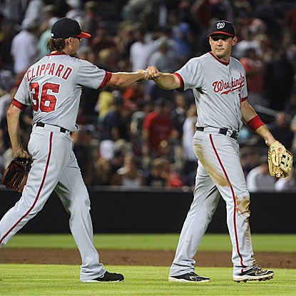 The Nationals' Ryan Zimmerman (right) congratulates Tyler Clippard on his scoreless ninth inning to earn the save.  (AP)