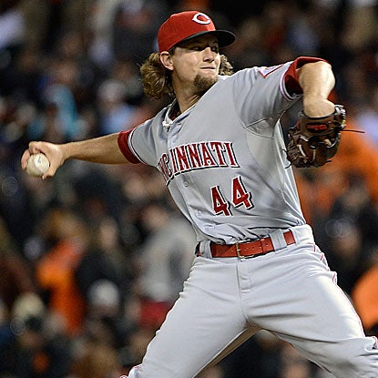 The Reds' Mike Leake hits a home run and throws his first career complete game in his win against the Giants.  (Getty Images)