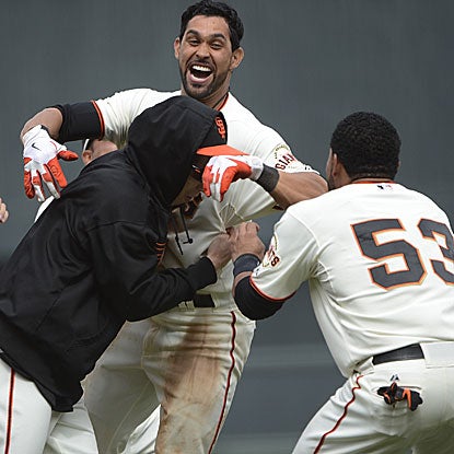 Angel Pagan's ninth-inning fly ball is misplayed by the Reds' Jay Bruce, allowing the Giants to score the game-winning run. (AP)
