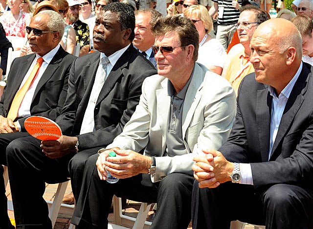 Palmer, here with Frank Robinson, Eddie Murray and Cal Ripken, plans to sell five of his trophies. (Getty Images)