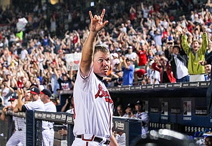 Chipper Jones acknowledges the standing ovation he receives upon leaving the game after his 5-for-5 performance.  (US Presswire)