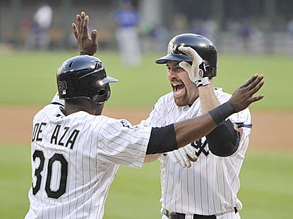 Alejandro De Aza greets Kevin Youkilis after the veteran hits a home run in first home plate appearance for the Pale Hose. (Getty Images)