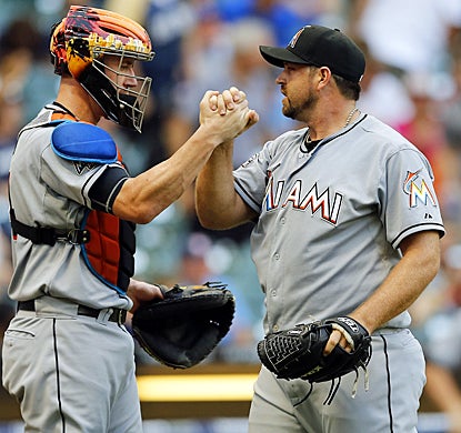 After coughing up a lead the day before, Heath Bell celebrates with John Buck after holding off the Brewers in the 10th inning. (AP)